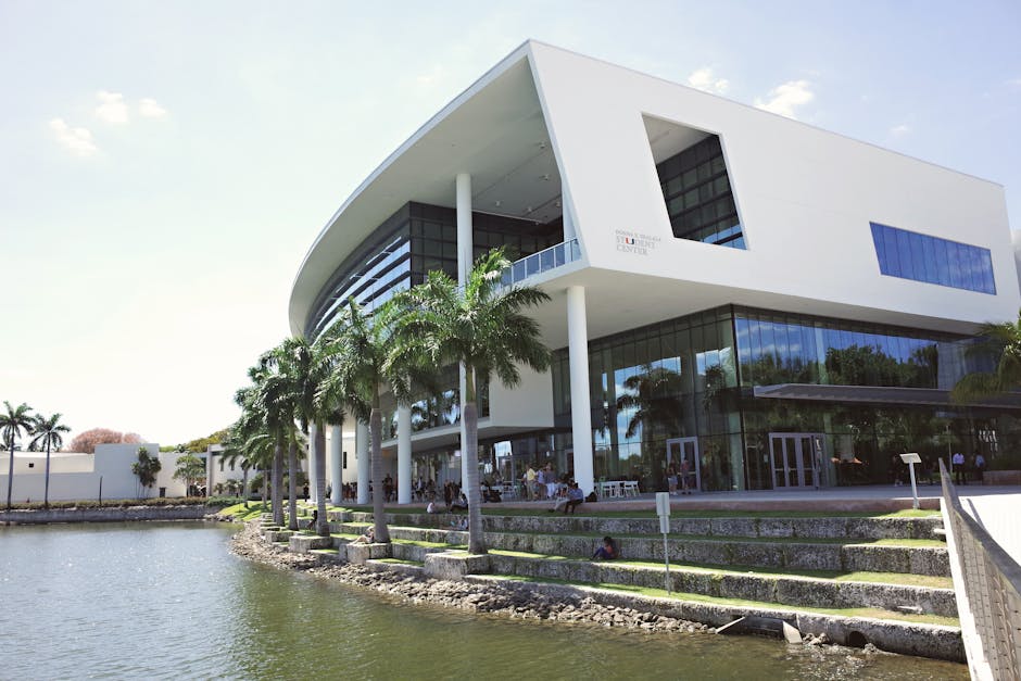Stunning view of the modern architecture at University of Miami campus, reflecting on the water.