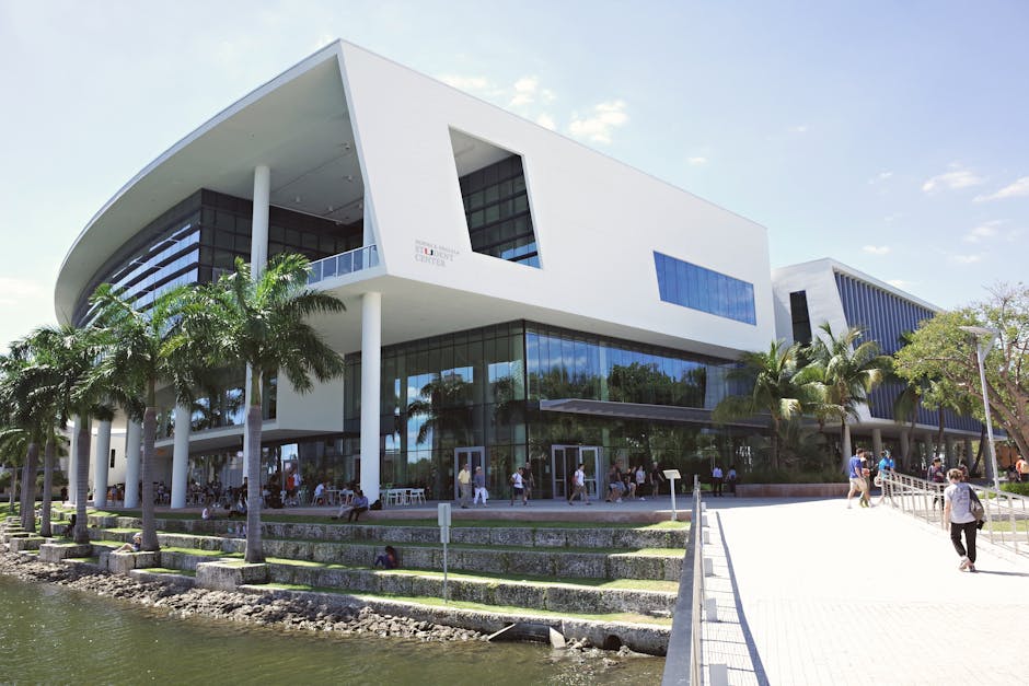 Contemporary architecture at the University of Miami campus with vibrant student life and lush surroundings.